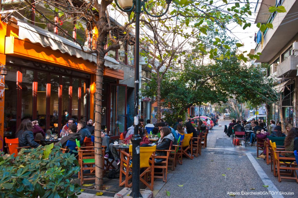 Exarheia neighborhood in Athens with young people sitting at cafes
