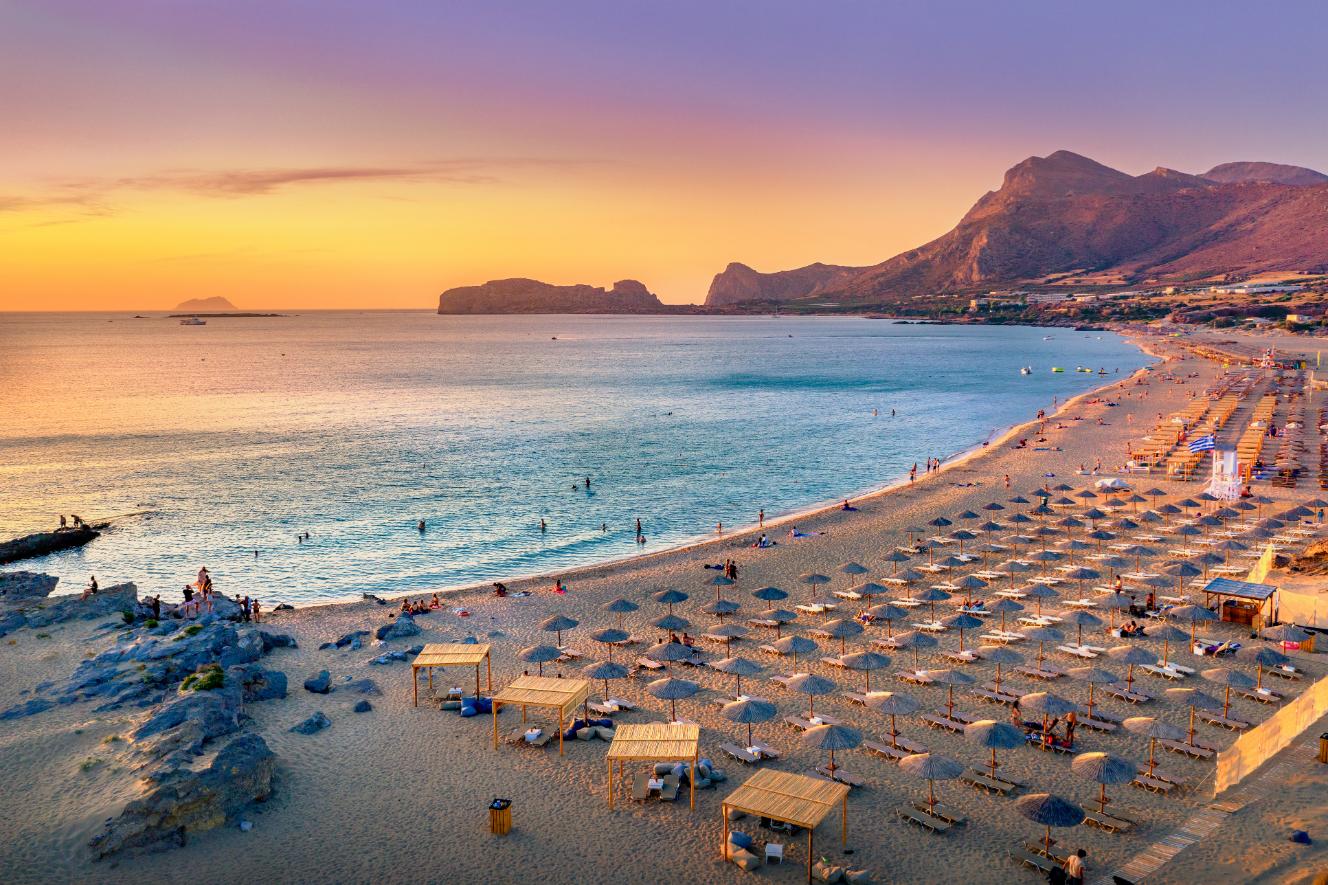 Falasarna Beach at sunset with golden sand and turquoise sea in Crete, Greece