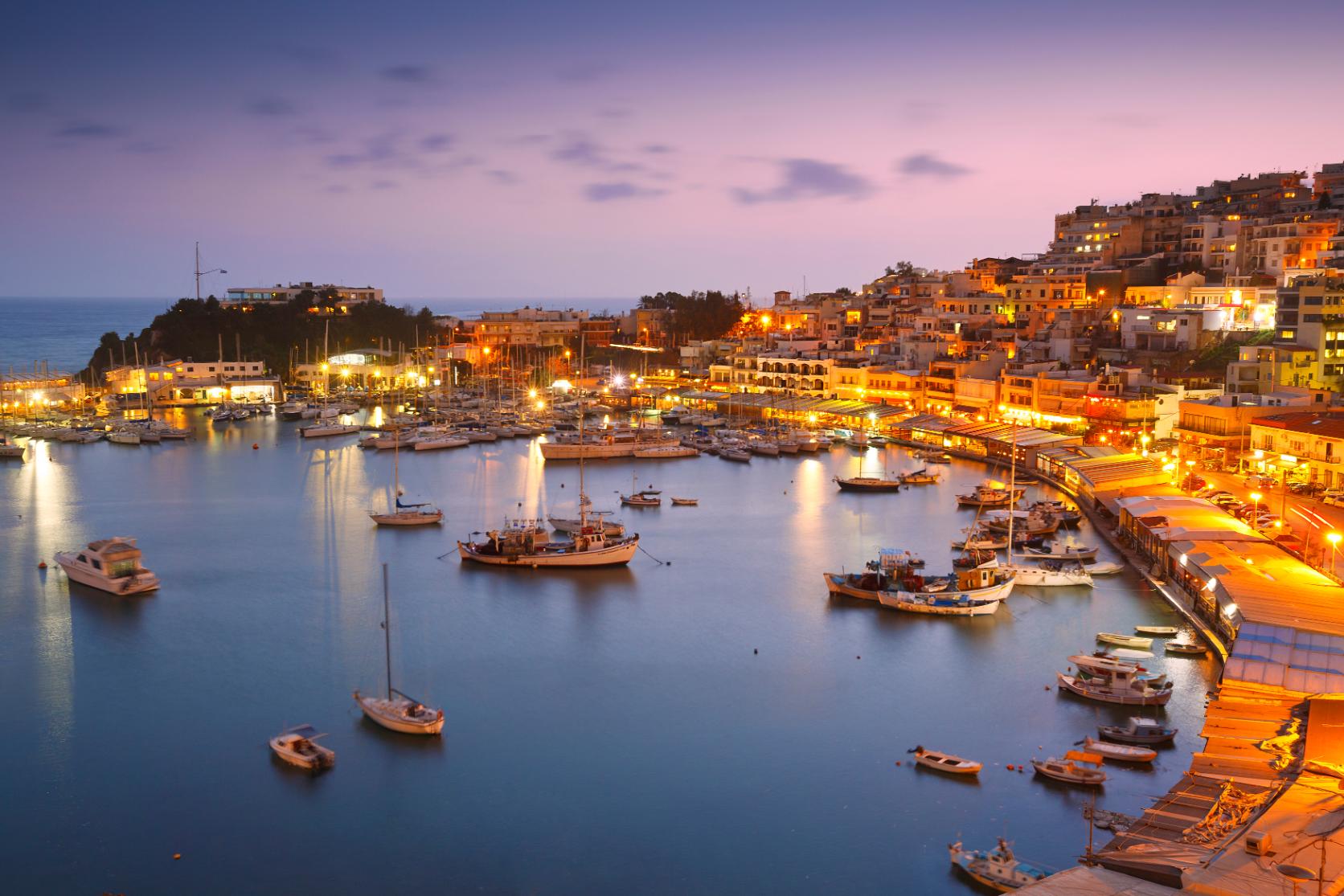 Mikrolimano harbor in Piraeus Athens at sunset with boats and waterfront restaurants