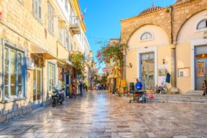 Charming pedestrian street in Nafplio Old Town with historic buildings, Greece