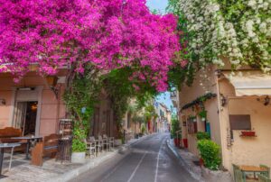 Charming street with bougainvillea flowers in Plaka neighborhood, Athens Greece