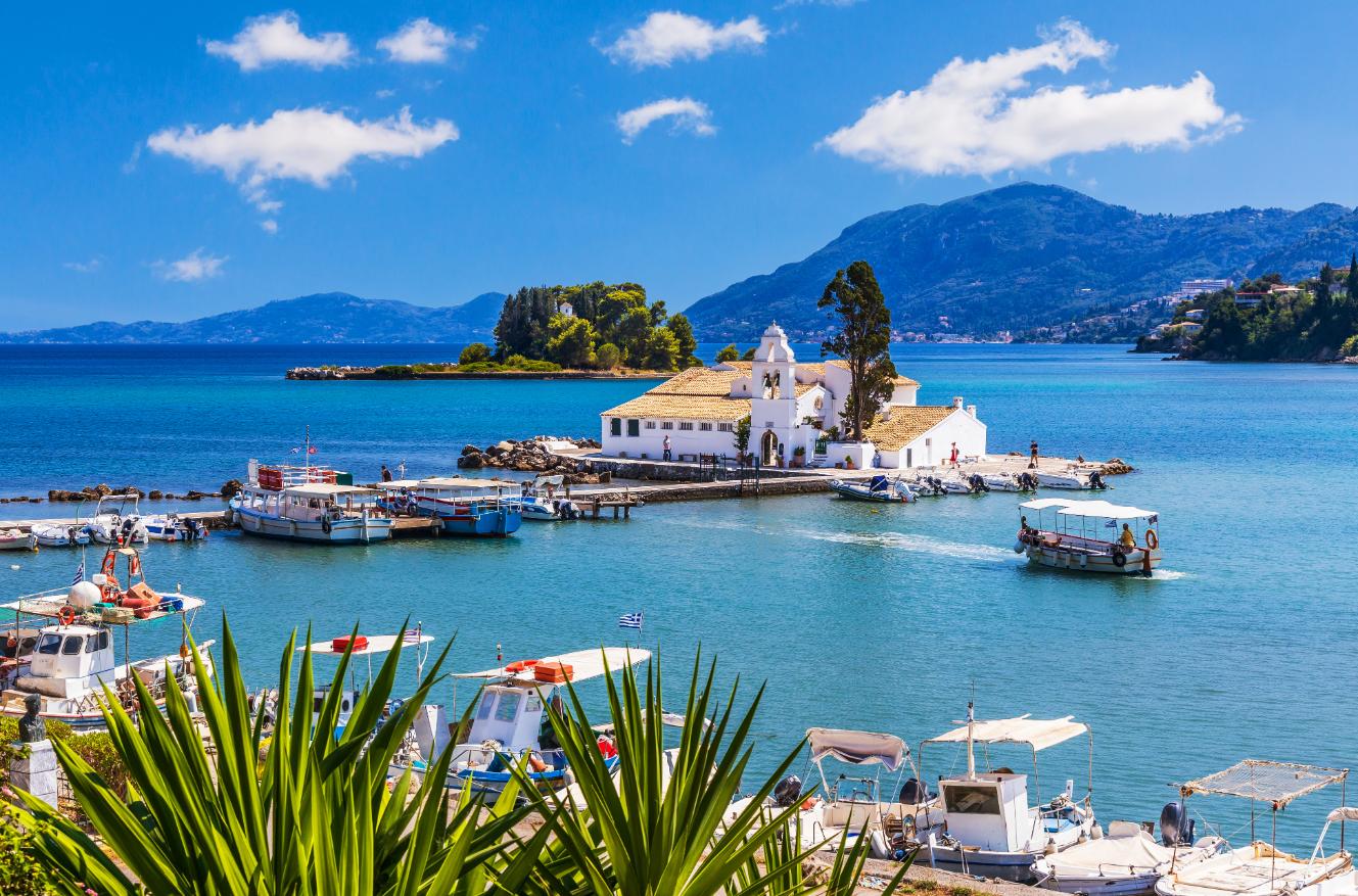 Pontikonissi Mouse Island with Vlacherna Monastery and boats in Corfu Greece