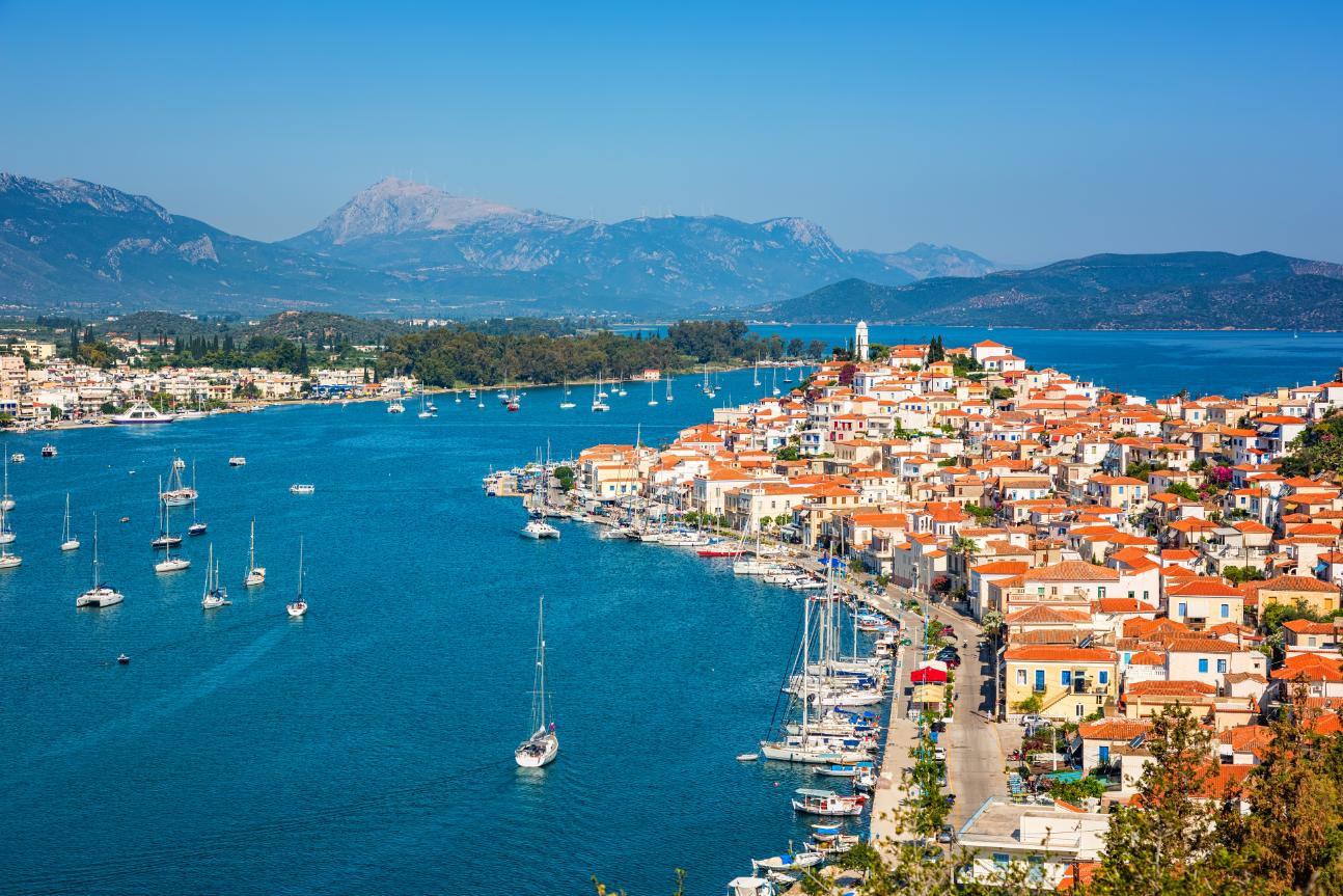 Poros Island harbor with colorful houses and sailing boats, Saronic Gulf Greece