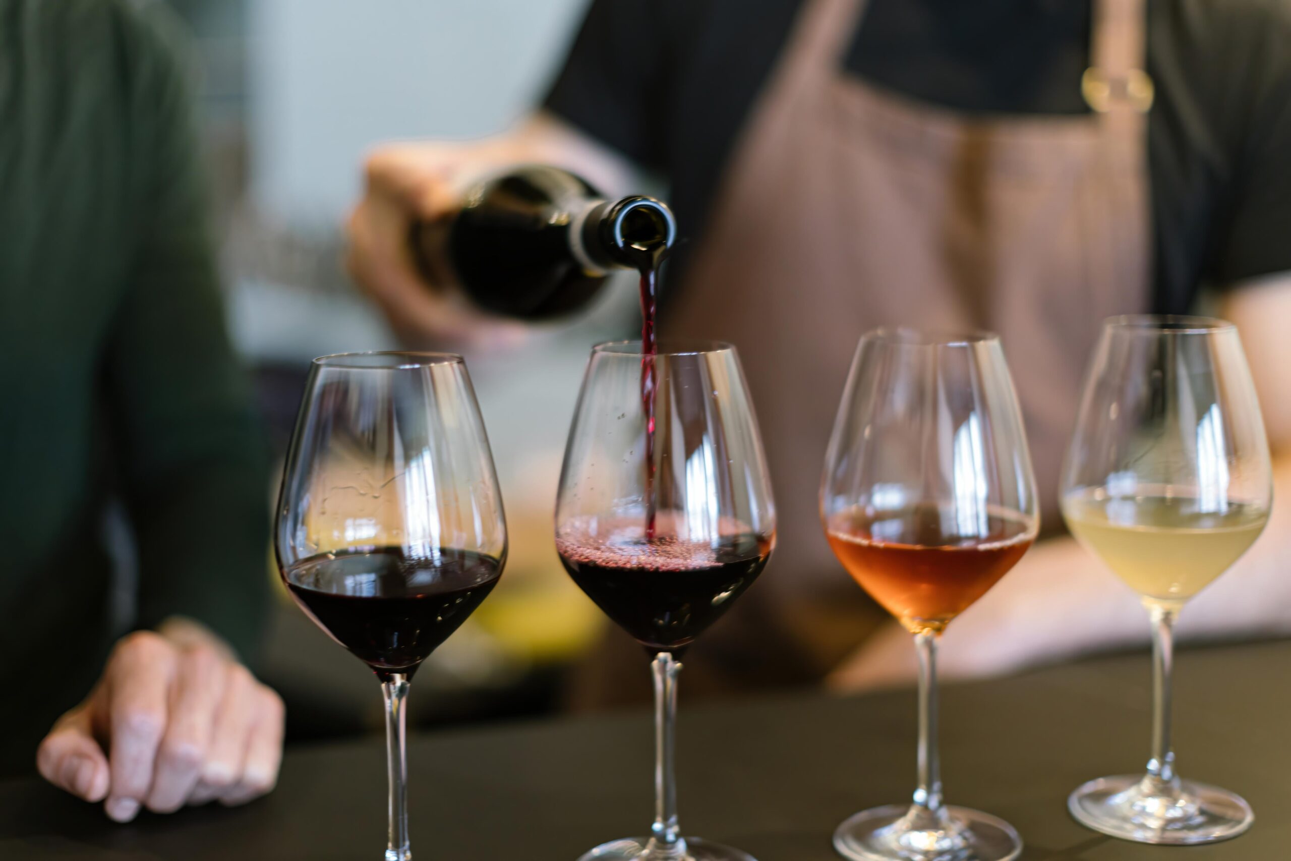 Wine tasting flight red rose white wines sommelier pouring glass