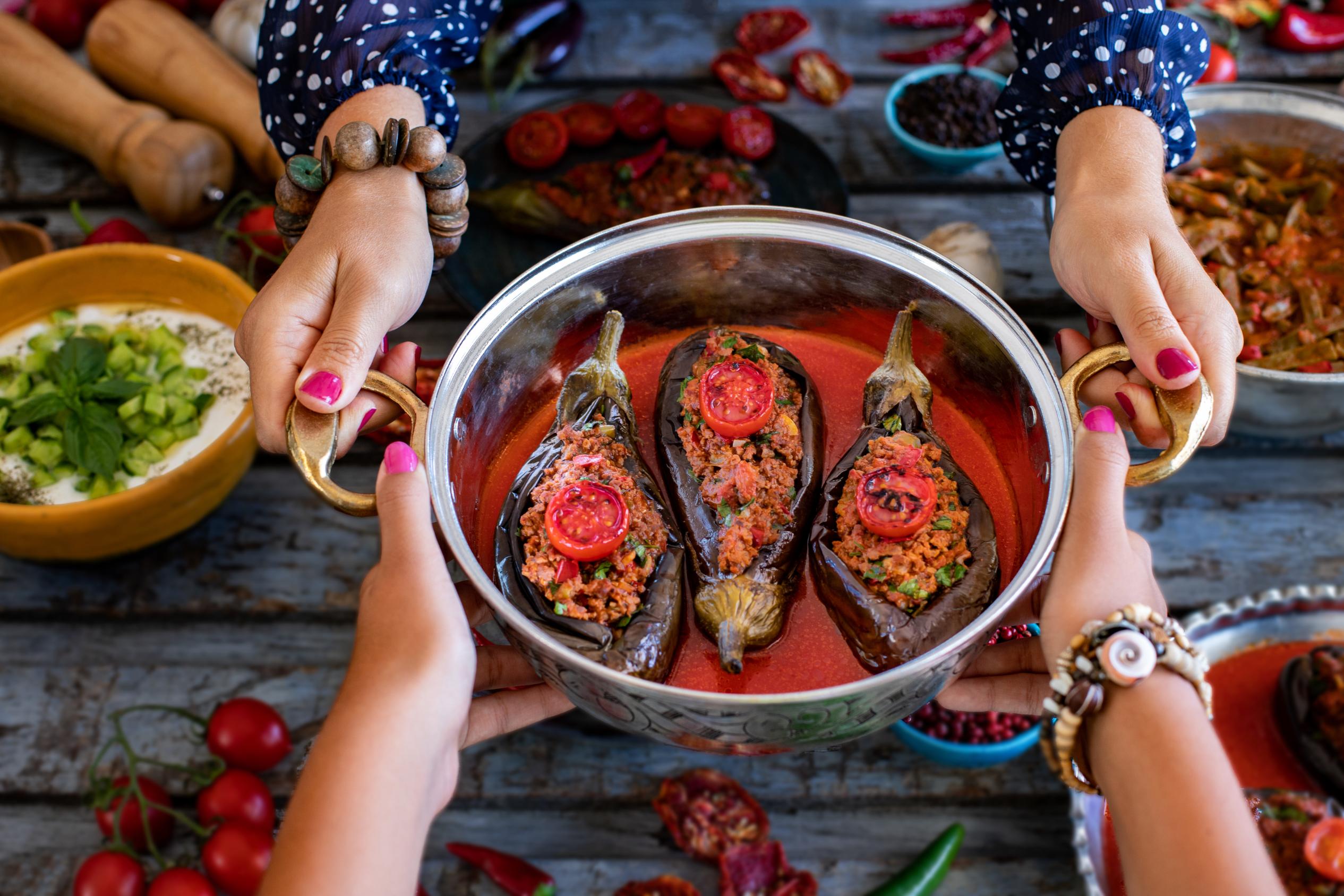 Greek cooking class stuffed eggplant dish hands preparing traditional recipe